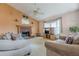 Cozy living room with a brick fireplace, neutral walls, and comfortable seating area at 2485 Shady Shoals Ct, Decatur, GA 30034