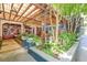 Stylish outdoor patio with a pergola, lush plants, and warm lighting at 2485 Shady Shoals Ct, Decatur, GA 30034