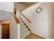 Carpeted staircase with wood trim and handrail, leading to the upper level at 2485 Shady Shoals Ct, Decatur, GA 30034
