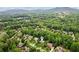 Aerial view of the home nestled amongst lush trees, showing the beauty and serenity of its surroundings at 2840 Astoria Ave, Cumming, GA 30040