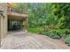 This covered back patio is the perfect space to enjoy the serene backyard setting at 2840 Astoria Ave, Cumming, GA 30040