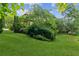 A large backyard with mature trees and landscaping provides shade and privacy at 2840 Astoria Ave, Cumming, GA 30040