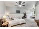 Large bedroom with a bed, lounge chair, ceiling fans and a decorative sign on the wall at 2840 Astoria Ave, Cumming, GA 30040