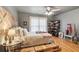 Comfortable bedroom with a unique headboard, hardwood floors, and a corner bookshelf at 2840 Astoria Ave, Cumming, GA 30040