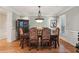 Formal dining room with hardwood floors and elegant chandelier at 2840 Astoria Ave, Cumming, GA 30040