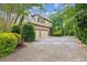 Side view of charming home with brick and stone accents and a spacious two-car garage at 2840 Astoria Ave, Cumming, GA 30040