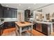 Large kitchen island with stainless steel appliances at 2840 Astoria Ave, Cumming, GA 30040