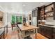 Spacious kitchen with an island, stainless steel appliances, wooden cabinets, and hardwood floors at 2840 Astoria Ave, Cumming, GA 30040