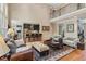 Open-concept living room, hardwood floors, and balcony overlook at 2840 Astoria Ave, Cumming, GA 30040