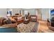 Comfortable living room with hardwood floors, decorative rug, with plentiful seating options at 2840 Astoria Ave, Cumming, GA 30040
