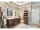 Luxurious main bathroom with dual vanities, soaking tub, a glass-enclosed shower, and travertine floors at 2840 Astoria Ave, Cumming, GA 30040