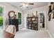 Comfortable office space with neutral colored carpet, natural light, and custom shelving at 2840 Astoria Ave, Cumming, GA 30040