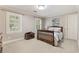 Cozy bedroom with neutral paint, plantation shutters, and a comfortable bed for relaxation at 1042 Trailridge Pl, Atlanta, GA 30338