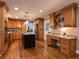 Spacious kitchen with wood cabinetry, granite countertops, stainless steel appliances, and a center island at 1042 Trailridge Pl, Atlanta, GA 30338