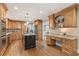 Warm and inviting kitchen with custom wood cabinetry, granite countertops, and a functional center island at 1042 Trailridge Pl, Atlanta, GA 30338