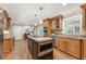 Bright eat-in kitchen features a kitchen island with granite countertops and stainless steel appliances at 1042 Trailridge Pl, Atlanta, GA 30338