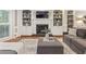 Inviting living room with a fireplace, built-in bookshelves, and comfortable seating for relaxation at 1042 Trailridge Pl, Atlanta, GA 30338