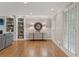 Bright living room with hardwood floors, built-in bookshelves, and sophisticated decor at 1042 Trailridge Pl, Atlanta, GA 30338