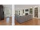 Cozy living room featuring plush seating, a fireplace, built-in shelving, and natural light at 1042 Trailridge Pl, Atlanta, GA 30338