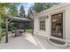 Charming backyard patio with a dining set and covered gazebo, perfect for outdoor gatherings at 1042 Trailridge Pl, Atlanta, GA 30338