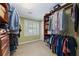 Spacious walk-in closet with custom shelving and ample storage for clothes and accessories at 1042 Trailridge Pl, Atlanta, GA 30338