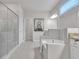 A luxurious bathroom with a glass shower and a soaking tub with tile surround at 6179 Ashbranch Dr, Acworth, GA 30101
