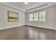 Bedroom featuring hardwood floors, a trey ceiling, and natural light from the windows at 6179 Ashbranch Dr, Acworth, GA 30101