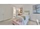 Bedroom featuring a bed with neutral bedding, pink decor, window and desk at 6179 Ashbranch Dr, Acworth, GA 30101