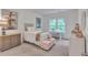 Cozy bedroom with a comfortable bed, pink decor, window and a white desk and chair at 6179 Ashbranch Dr, Acworth, GA 30101