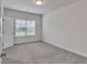 An empty bedroom is bright and spacious, featuring a window for lots of natural light at 6179 Ashbranch Dr, Acworth, GA 30101
