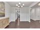 Elegant dining room with dark wood floors, wainscoting, and ample space for entertaining guests at 6179 Ashbranch Dr, Acworth, GA 30101