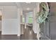 Bright foyer featuring hardwood floors and paneled walls for an elegant first impression at 6179 Ashbranch Dr, Acworth, GA 30101