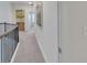 Hallway with wall art, decorative trim, and wall switches at 6179 Ashbranch Dr, Acworth, GA 30101