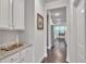 Hallway with granite counter and view to a kitchen, offering a glimpse of modern interior design at 6179 Ashbranch Dr, Acworth, GA 30101