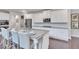 Modern kitchen with stainless steel appliances, granite island, and ample cabinet space, perfect for cooking at 6179 Ashbranch Dr, Acworth, GA 30101