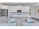 Close-up of kitchen island featuring granite countertops, stainless sink, and sleek cabinets for a modern look at 6179 Ashbranch Dr, Acworth, GA 30101