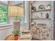 Living room boasts a table lamp next to a large window at 6179 Ashbranch Dr, Acworth, GA 30101