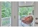 Inviting porch with comfortable seating and a view of the lush greenery at 6179 Ashbranch Dr, Acworth, GA 30101