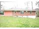 Image of backyard showing the full brick exterior of the house at 1693 Montreal Rd, Tucker, GA 30084