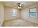 Bedroom with neutral carpet, two windows, and a ceiling fan at 1693 Montreal Rd, Tucker, GA 30084