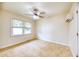 Bright bedroom featuring neutral carpet and a modern ceiling fan at 1693 Montreal Rd, Tucker, GA 30084