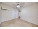 Bedroom featuring neutral carpet, ceiling fan, double closet and an external AC unit at 1693 Montreal Rd, Tucker, GA 30084
