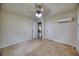 Bedroom featuring neutral carpet, ceiling fan, external AC unit and closet at 1693 Montreal Rd, Tucker, GA 30084