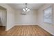 Comfortable dining room features modern chandelier and laminate flooring at 1693 Montreal Rd, Tucker, GA 30084