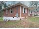 Brick house featuring white shutters, and exterior AC unit at 1693 Montreal Rd, Tucker, GA 30084