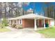 Charming single-story brick home with a convenient carport and well-maintained landscaping at 1693 Montreal Rd, Tucker, GA 30084