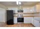 Traditional kitchen with white cabinets, stainless steel appliances and hardwood floors at 1693 Montreal Rd, Tucker, GA 30084
