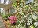 Landscaped garden with brick trim and colorful flowers adorns the front of this home, adding curb appeal at 1693 Montreal Rd, Tucker, GA 30084