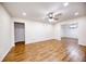 Bright living room with new laminate wood flooring, recessed lighting, and fresh, neutral paint at 1693 Montreal Rd, Tucker, GA 30084
