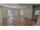Spacious bedroom with hardwood floors, recessed lighting, and natural light from two windows at 1978 Fisher Trl, Atlanta, GA 30345